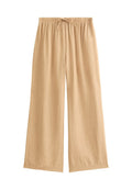 Beige weite Hosen aus leichtem, strukturiertem Stoff mit einem elastischen Bund und einer Kordelzugdetails.