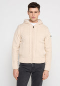 Cremfarbener Kabelstrick-Hoodie mit strukturiertem Design, einem vollständigen Reißverschluss und einem gerippten Saum. Verfügt über eine Kapuze mit Kordelzug und seitliche Taschen.