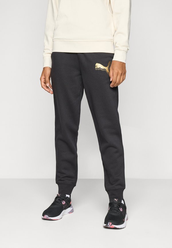 Puma SWEATPANTS - Tracksuit bottoms - black/metallic gold-coloured