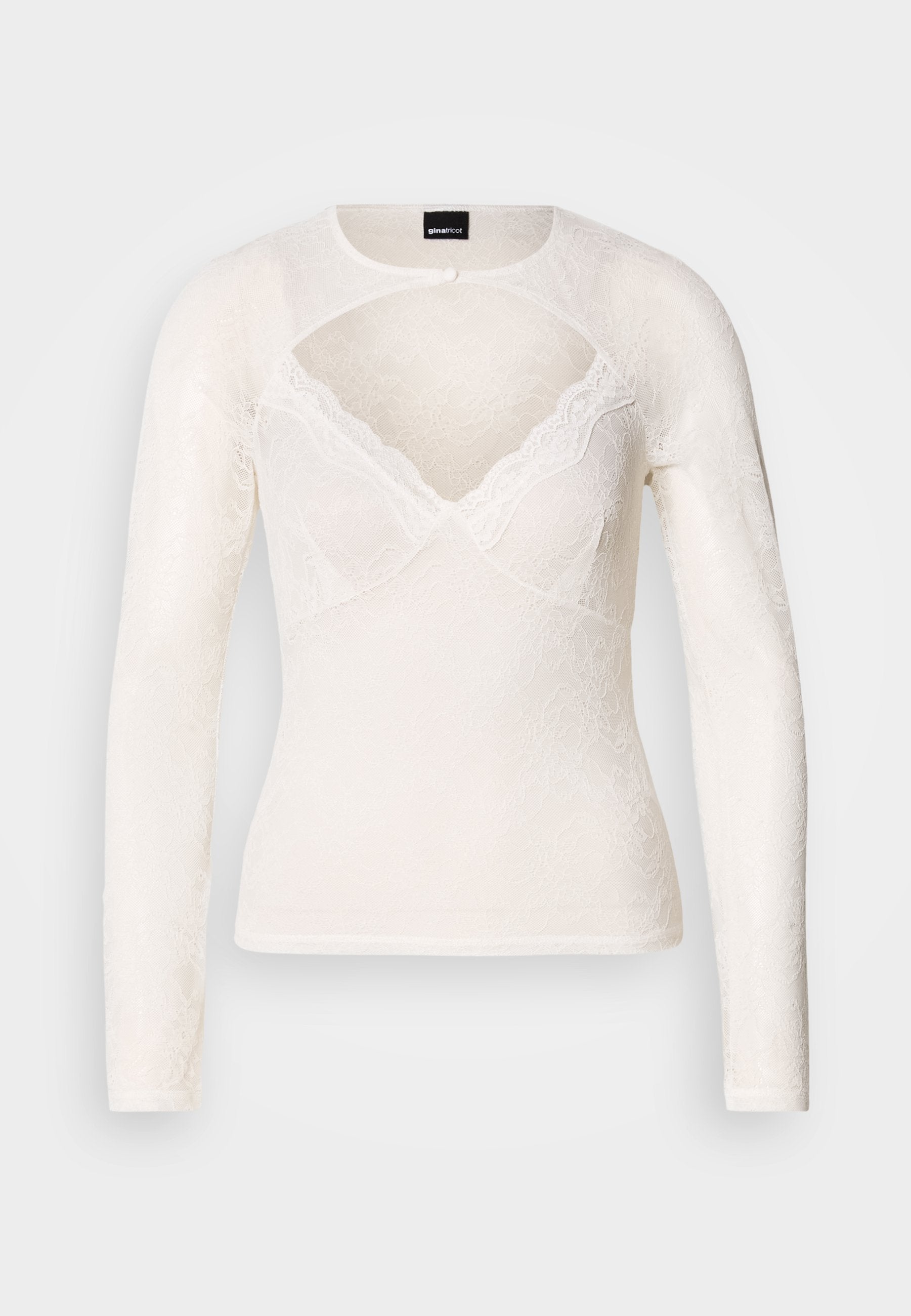 Weißes Langarmshirt aus Spitze mit V-Ausschnitt und zarter Spitzenverzierung entlang des Halsausschnitts. Verfügt über einen Knopfverschluss am Kragen.