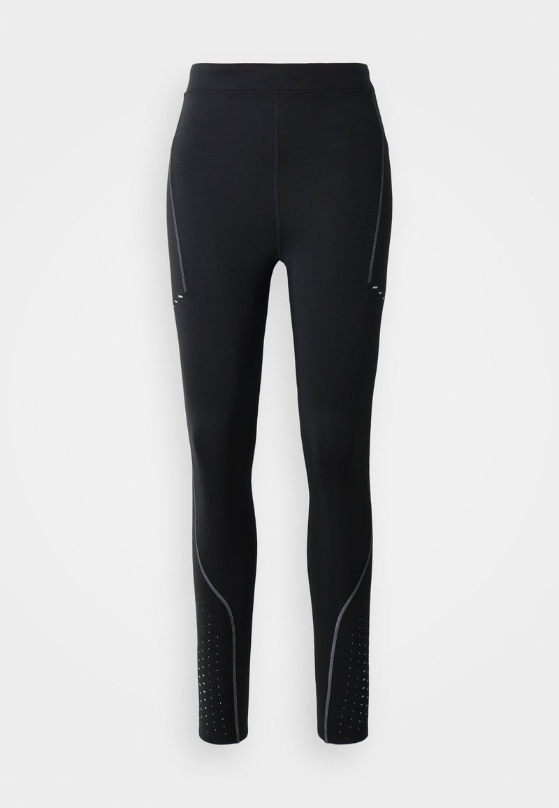 Schwarze Leggings mit einem hohen Bund, versehen mit silbernen Akzentnähten, Seitentaschen und gepunkteten Perforationen entlang der Unterschenkel.