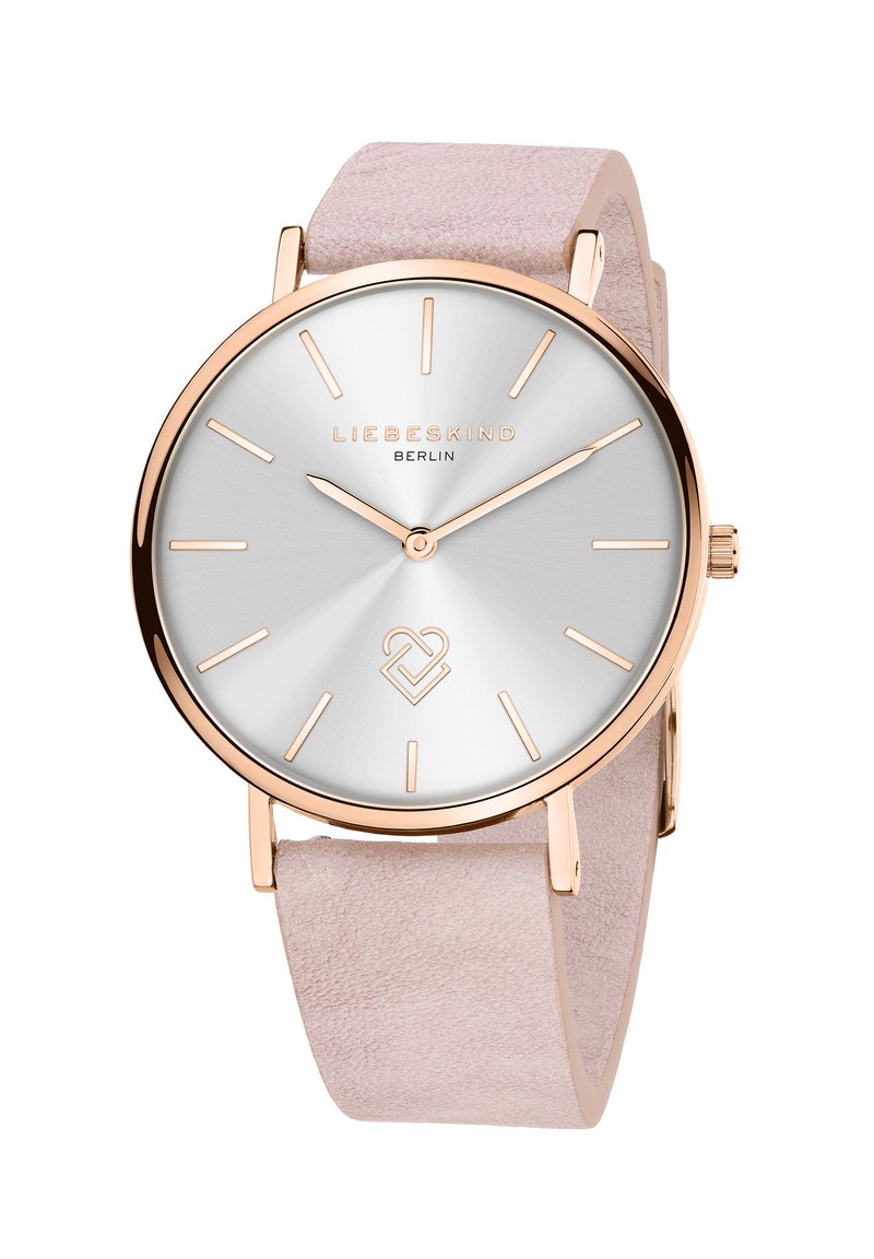 Rosé-goldene Uhr mit einem silbernen Sonneburst-Zifferblatt, dünnen Stunden- und Minutenzeigern sowie einem hellrosa Wildlederarmband. Verfügt über minimalistische Indizes und Branding.