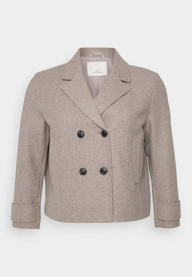 Doppelt geschnittene Jacke aus einem hellbeigen Wollmix. Mit schwarzen Knöpfen, einem Reverskragen und einer einzelnen Tasche auf der rechten Seite.
