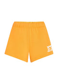 Gelbe Baumwollshorts mit einem elastischen Bund und einem weißen Grafikdruck auf dem linken Bein. Gerader Saum und weiche Textur.