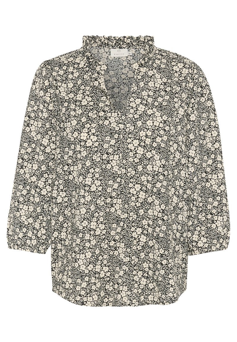 Schwarze und weiße Bluse mit floralen Mustern, tiefem V-Ausschnitt, Rüschenkragen und Dreiviertelärmeln. Hat ein kleines, durchgängiges Blumenmuster.