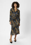 Kleid mit floralem Druck, langen Ärmeln, schwarzer Basis und gelb-blauem Muster. Mit Taillenbindung und mittellangem Saum, weiche Stoffstruktur.