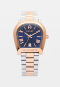 Uhren aus roségold und Silber mit einem abgerundet rechteckigen Gehäuse, blauem Zifferblatt, römischen Ziffern und einem Datumsdisplay. Schweizer Herstellung.