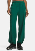 Under Armour RIVAL WOVEN - Tracksuit bottoms - campus ivy