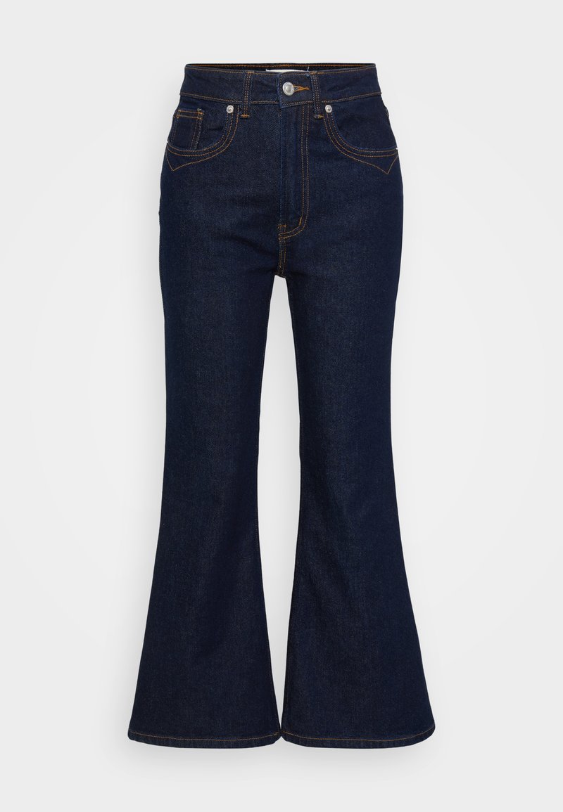 Dunkelblaue, hochtaillierte Denim-Jeans mit ausgestellten Beinen, Knopf- und Reißverschluss vorne sowie kontrastierendem orangefarbenem Nähen.