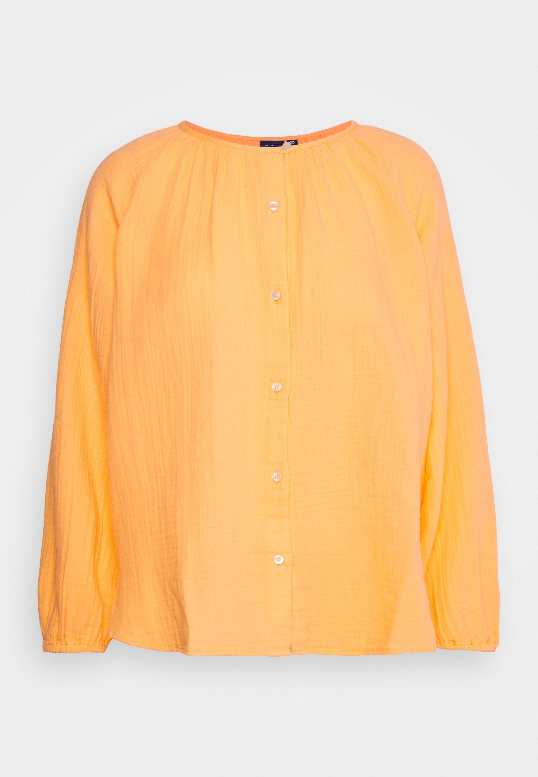 Gelbes, leichtes Langarmshirt mit Rundhalsausschnitt, Knopfverschluss und strukturiertem Stoff. Schlichtes Design und elastische Bündchen.
