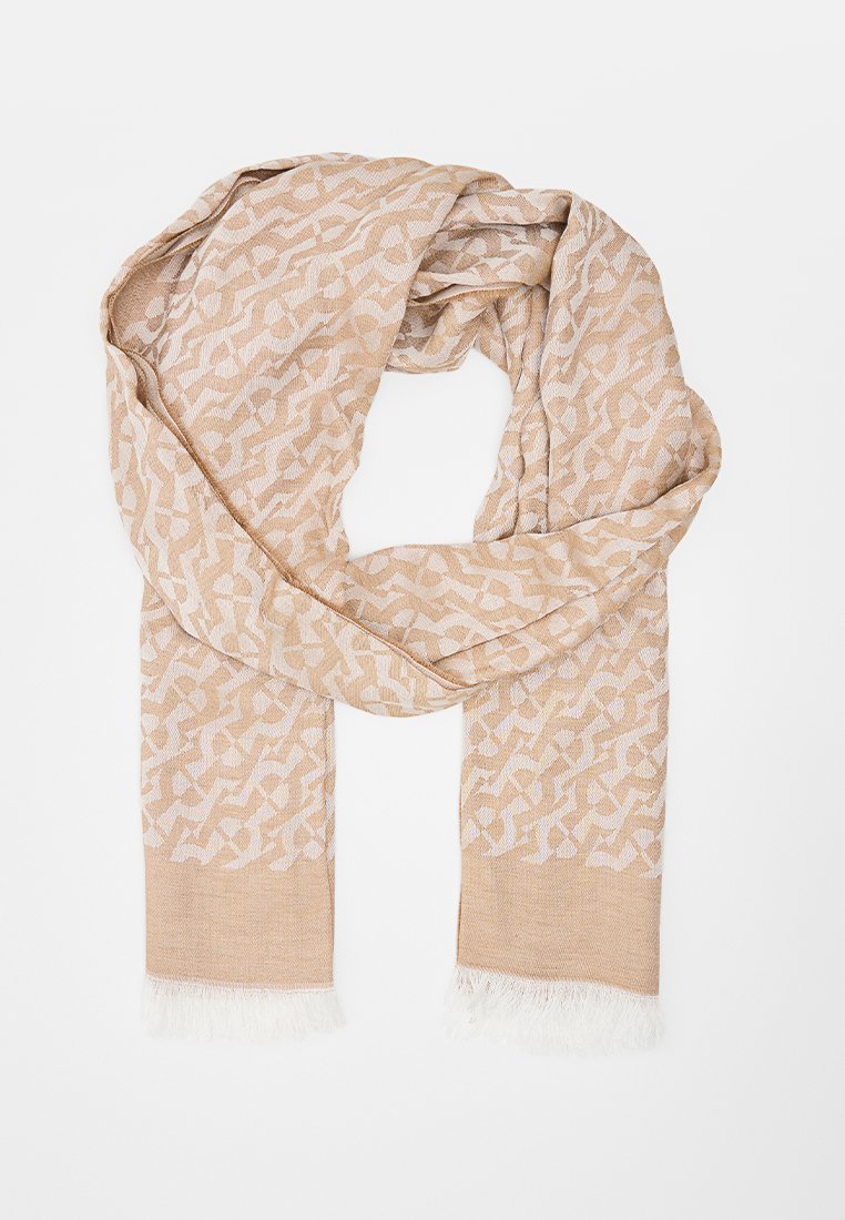 Beiger Schal mit geometrischen Mustern. Leichtes Material, fransige Enden und weiche Textur. Geeignet zum Schichten oder für den Casual-Look.