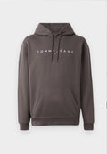 Graue Kapuzenjacke mit klassischem Schnitt, Zugband-Kapuze, vorderer Kangurutasche und weißem "TOMMY JEANS"-Logo auf der Brust. Weicher Stoff.