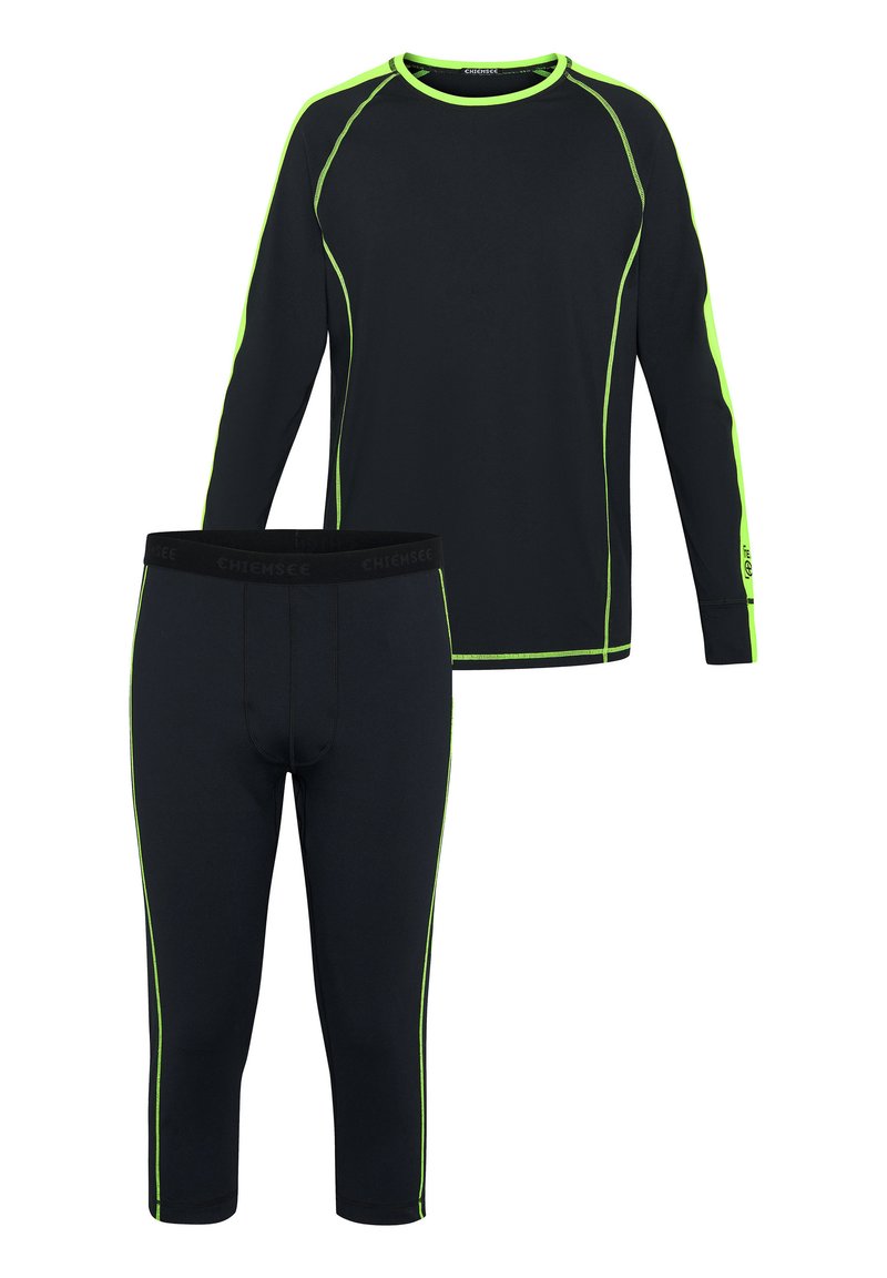Schwarzes langärmliges Oberteil und dreiviertellange Leggings mit neongrünen Akzentnähten. Der Stoff wirkt glatt und dehnbar. Das Markenlogo ist auf dem Bund sichtbar.