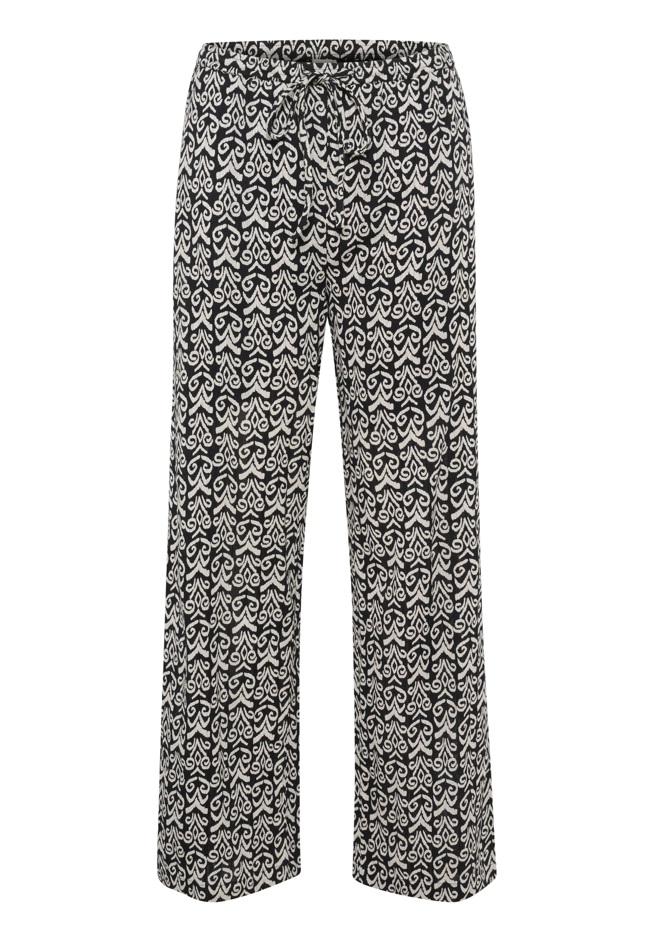 Schwarz-weiße gemusterte Hose mit entspanntem Schnitt, ausgestattet mit einem Kordelzugbund und weit fließenden Beinen, die mit kunstvollen Designs verziert sind.