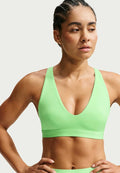 Nike Performance W NK DF INDY STRAPPY BRA - Medium support sports bra - illusion green/black