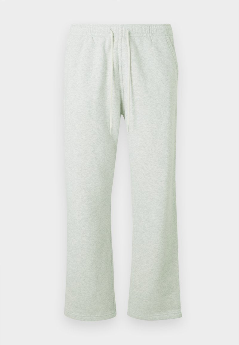 Hellgraue Jogginghose mit elastischem Bund, Kordelzug und geraden Beinen. Weicher Stoff mit subtiler Textur und ohne Muster.