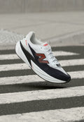 New Balance FUELCELL REBEL V5 - Road running shoes - white/neo flame