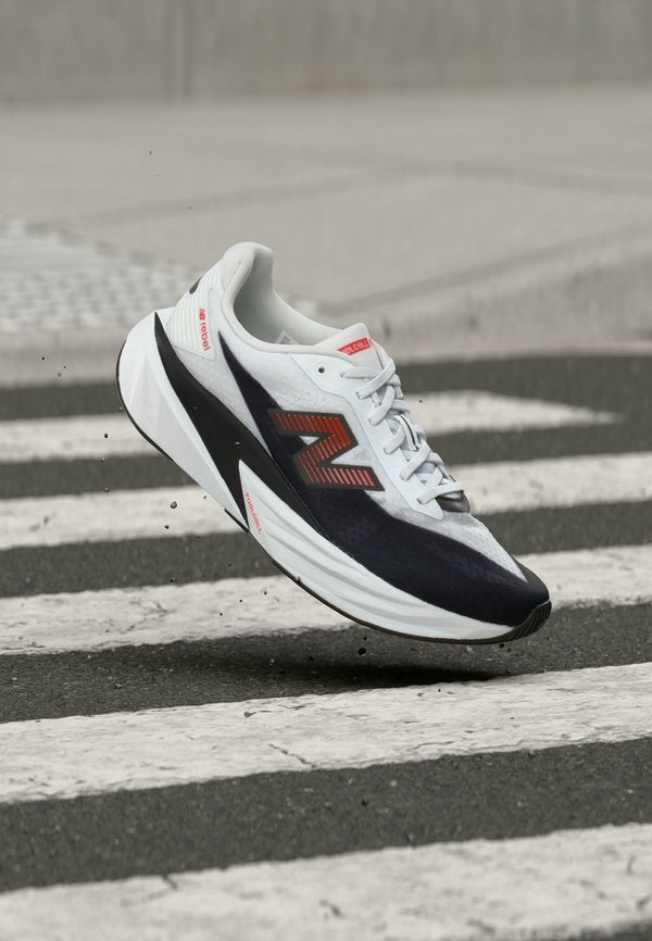 New Balance FUELCELL REBEL V5 - Road running shoes - white/neo flame