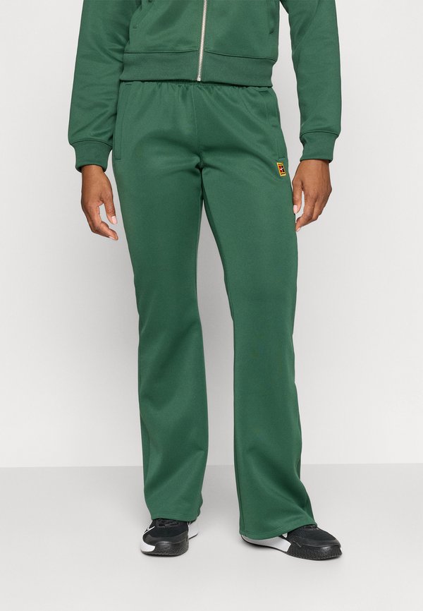 Nike Performance NIKECOURT PANT HERITAGE - Tracksuit bottoms - fir