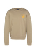 Beige Sweatshirt mit Rundhalsausschnitt, gerippten Bündchen und Saum. Mit einem orangen Stern- und Chevron-Motiv auf der Brust. Weicher, legerer Stoff.