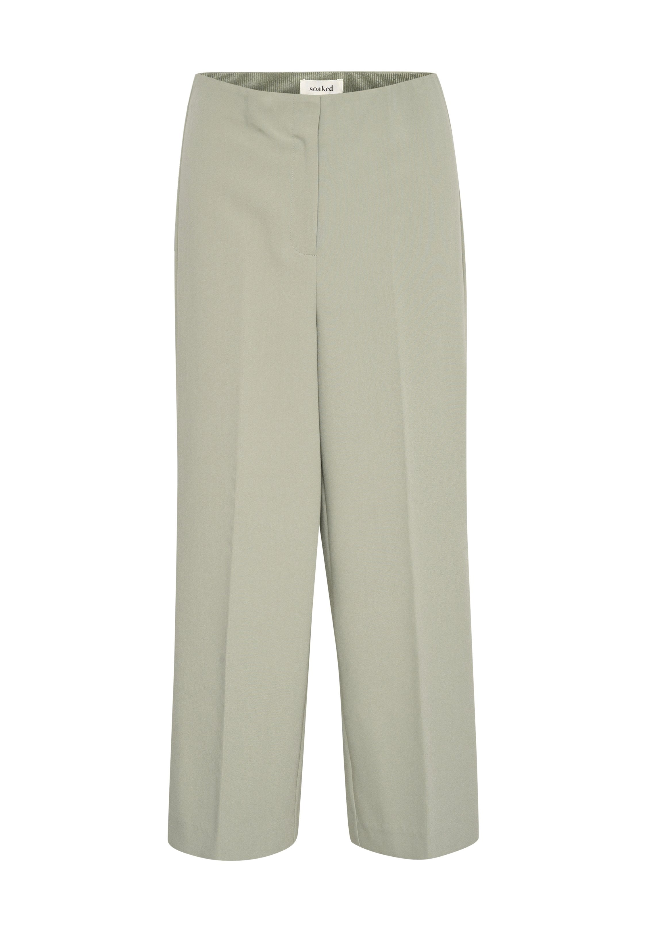 Hellgrüne, weite Hose aus glattem Material mit hoher Taille, die eine vordere Bügelfalte und ein minimalistisches Design aufweist.