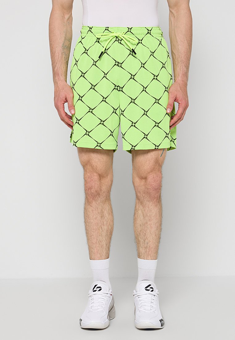 Limettengrüne Badeshorts mit schwarzem Rautenmuster, elastischem Bund und Kordelzug, mit Seitentaschen. Hergestellt aus leichtem Stoff.