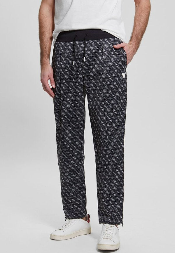 Guess ALLOVER LOGO - Tracksuit bottoms - schwarz