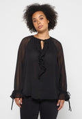 Schwarze durchsichtige Bluse mit langen Ärmeln, Rüschendetail an der Vorderseite und Bindeverschluss am Kragen. Elastische Manschetten mit Kordelzügen. Weicher Stoff.