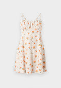 Ärmelloses, knielanges Kleid in Creme mit Orangenfruchtmuster und schwarzen Punkten. Geraffter Mieder und ausgestellter Rock. Leichter Stoff.
