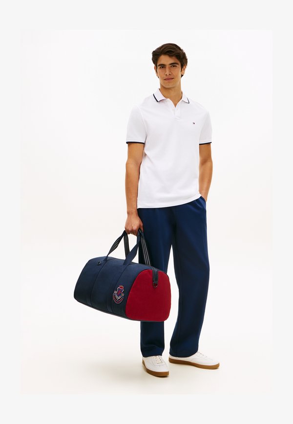 Tommy Hilfiger HERITAGE COLOUR-BLOCKED CANVAS DUFFEL BAG - Sports bag - space blue