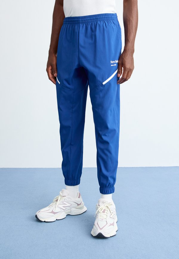 New Balance REIMAGINED - Tracksuit bottoms - blue