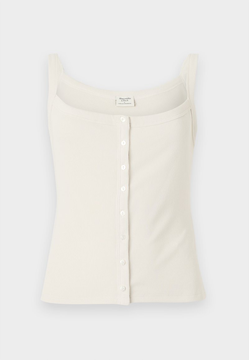 Cremfarbener, gerippter Tanktop mit verstellbaren Spaghettiträgern, vorderem Knopfverschluss und glatter Textur. Das Etikett befindet sich innen.