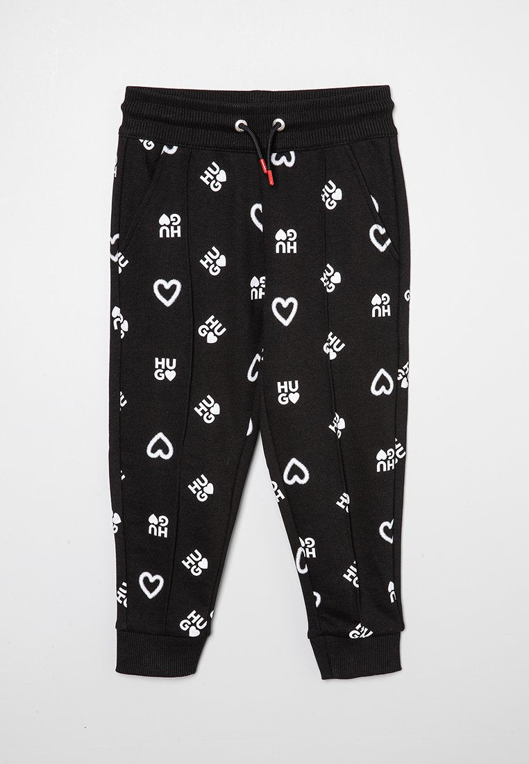 Schwarze Jogginghosen mit weißem "HUG"-Text und Herzmustern, ausgestattet mit einem Kordelzugbund und gerippten Bündchen für einen figurbetonten Look.