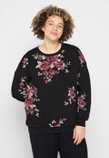 Schwarzer Sweatshirt aus weichem Stoff mit floralen Mustern in Rot und Pink sowie grünen Blättern, lässiger Schnitt und Rundhalsausschnitt.