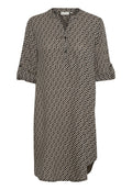 Schwarz-creamfarbenes Tunika-Hemd mit kurzen Ärmeln, V-Ausschnitt, geometrischem Muster und asymmetrischem Saum. Hergestellt aus leichtem Stoff.