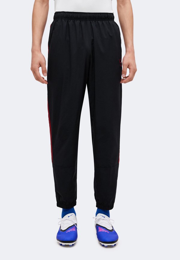 Nike Performance Tracksuit bottoms - black/team red