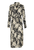Langes, knöpfbares Kleid mit einem schwarz-beige gesprenkelten Muster. Hergestellt aus glattem Stoff, hat es eine taillierte Taille und lange Ärmel.