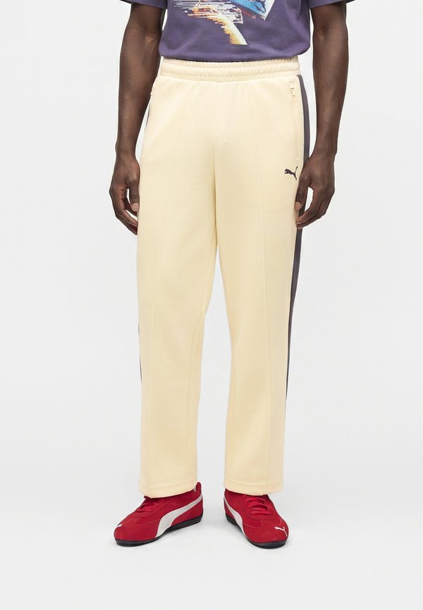 Puma ALWAYS ON RELAXED TRACK PANTS - Tracksuit bottoms - buttercream/inky depths