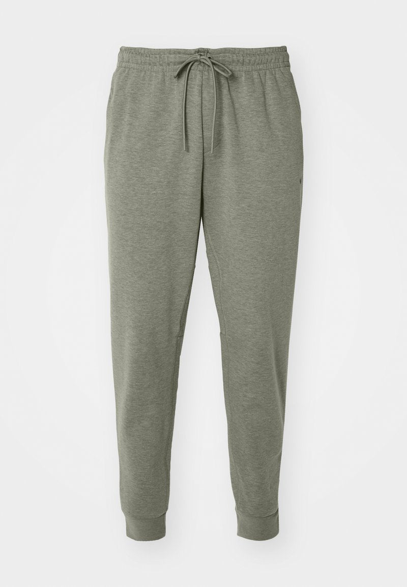 Graue Jogginghosen mit elastischem Bund und Kordelzug, gefertigt aus weichem Material. Verfügt über Seitentaschen und schmal zulaufende Bündchen.