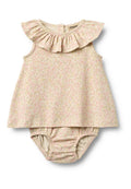 Babykleid mit Blumenmuster, ausgestatteter Rüschenkragen, weichem beigem Stoff und angebauten Höschen mit Druckknöpfen.