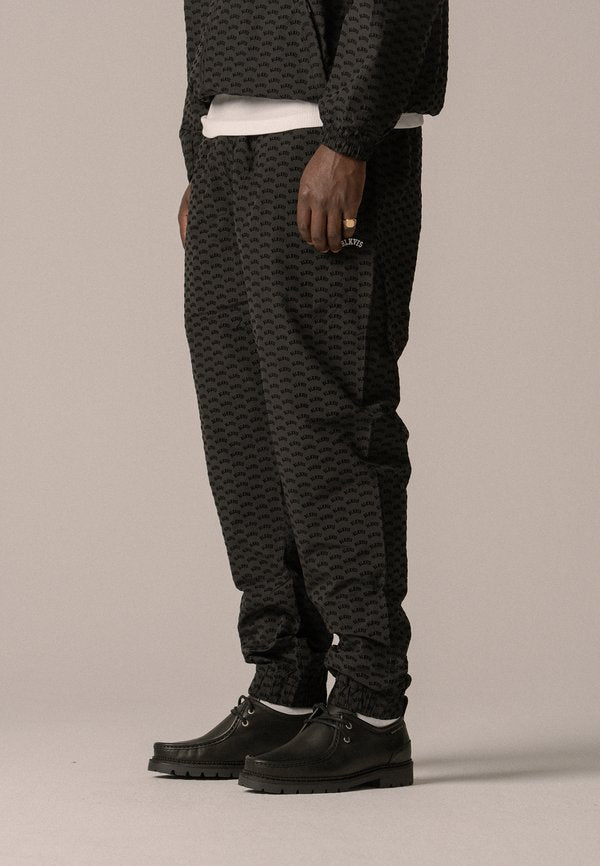BLKVIS ALLOVER TRACK PANTS UNISEX