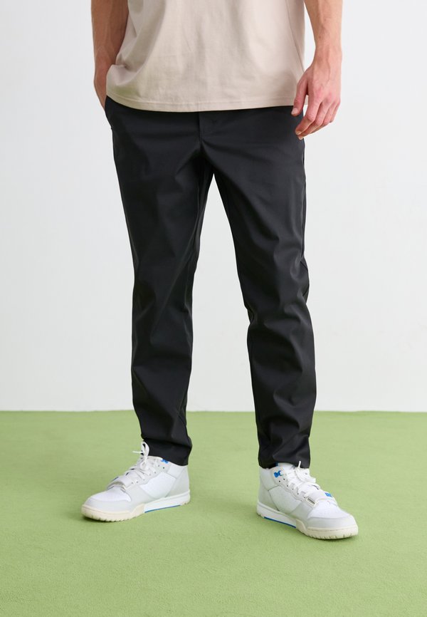 New Balance ATHLETICS STANDARD TAPERED PANT 30" - Chinos - black