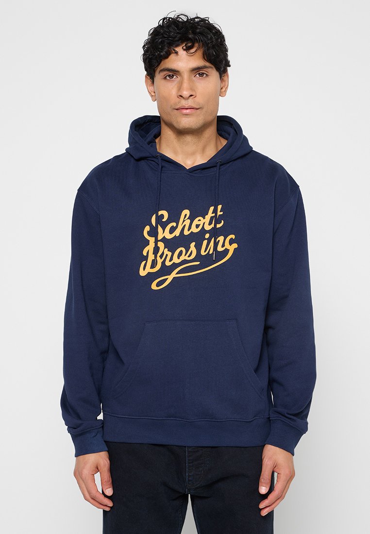 Marineblaue Kapuzenjacke aus Baumwollmischung, mit einer Kängurutasche vorne und einem gelben Vintage-Logo auf der Brust.