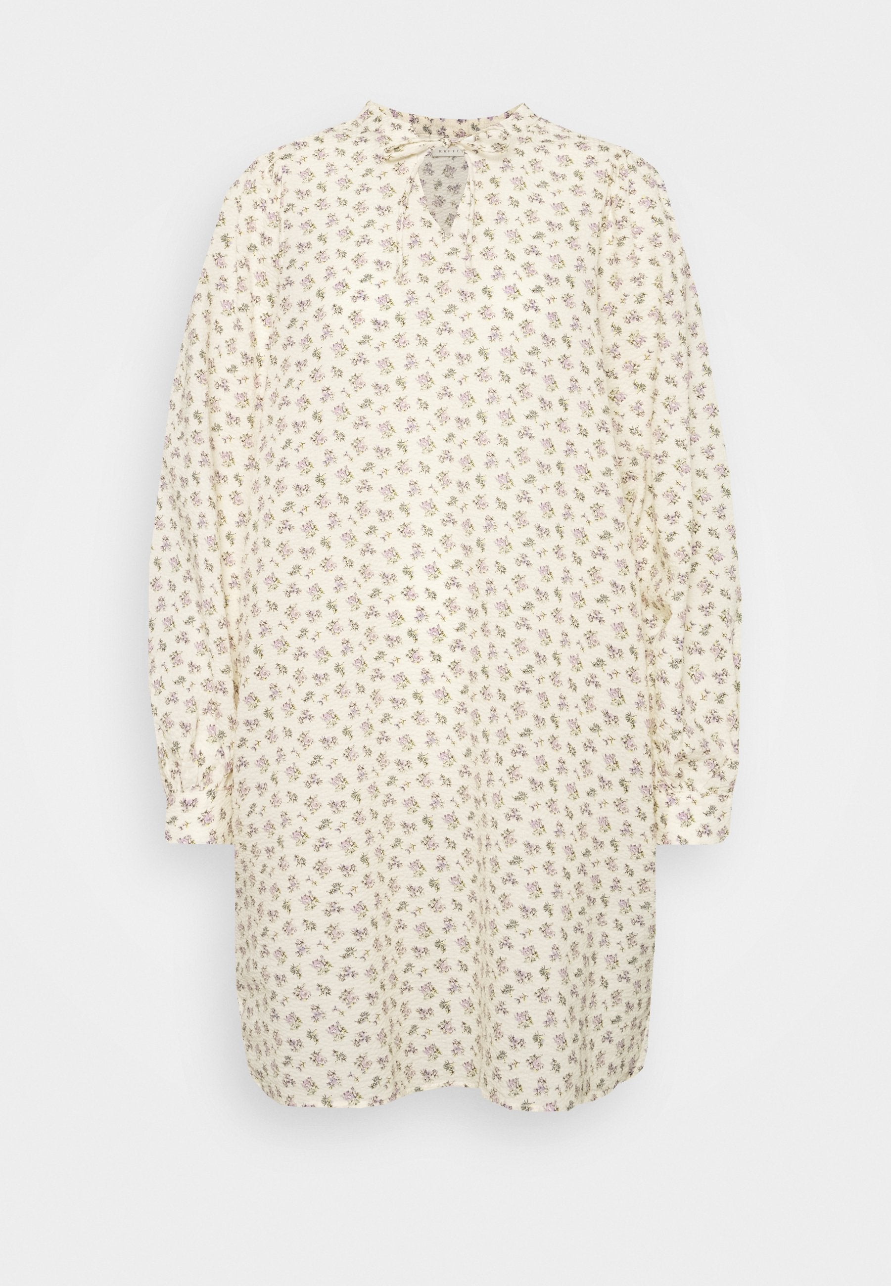 Blumenkleid in Creme mit kleinen lila Blumen, langärmlig, hoher Kragen und Schlitzdetail vorne. Weicher Stoff.