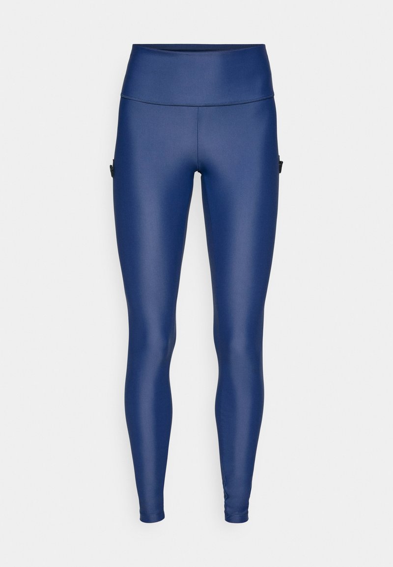 Navyblaue, hoch taillierte Leggings mit seitlichen Taschen, aus glattem, elastischem Stoff.