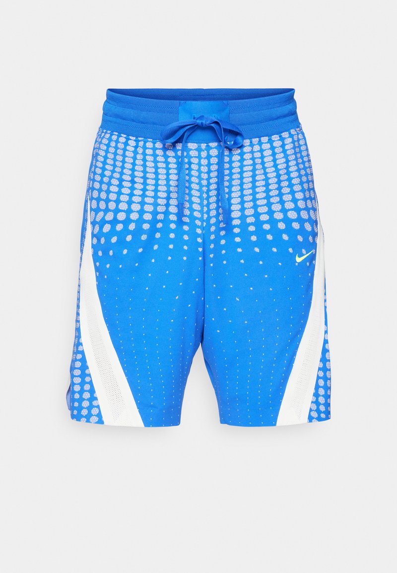 Blaue Sportshorts mit gepunktetem Muster, elastischem Bund mit Kordelzug und weißen Akzenten an den Seiten. Nike-Logo-Detail vorhanden.