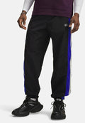 Under Armour ICON WOVEN TRACK - Tracksuit bottoms - ultimate black