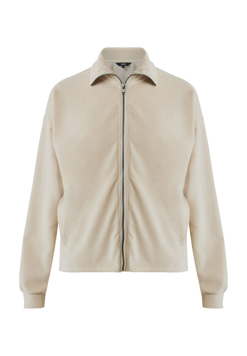 Beige Reißverschlussjacke mit weichem Material, ausgestattet mit einem umklappbaren Kragen und gerippten Bündchen, konzipiert mit einer lockeren Passform und seitlichen Taschen.