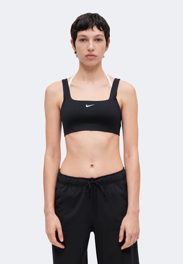 Nike Performance W NK1 DF STRAPPY PAD BRA E+ - Light support sports bra - black/white