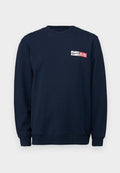 Navy-blaues Sweatshirt aus weichem Material, mit Rundhalsausschnitt, langen Ärmeln und einem weißen/roten Logopatch in der Mitte der Brust.